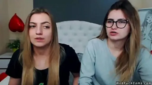 Two brunette amateur teen lesbian hotties stripping and tying in bed then licking in their private live webcam show on homemade footage